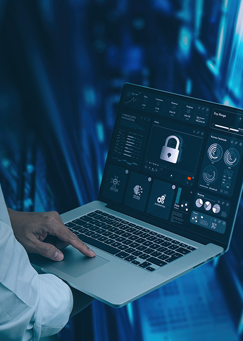 man using laptop to review online system security status reports